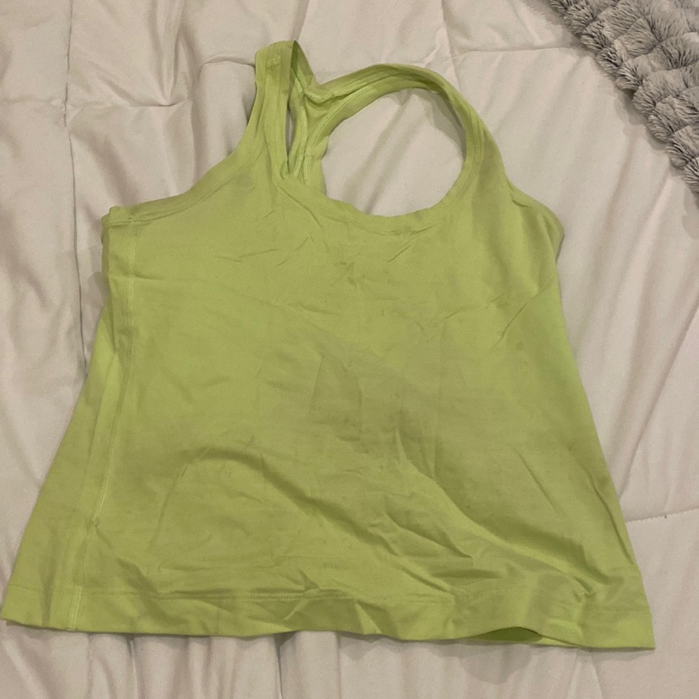 Like green Lulu lemon tank.